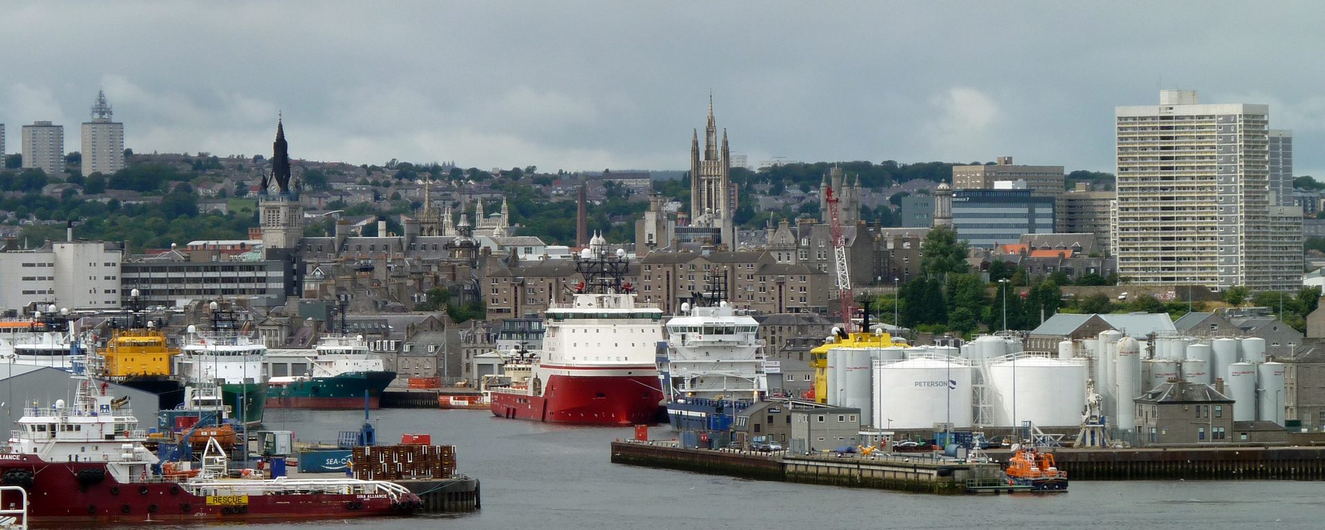 Supply ships in Aberdeen harbour, the granite city behind them