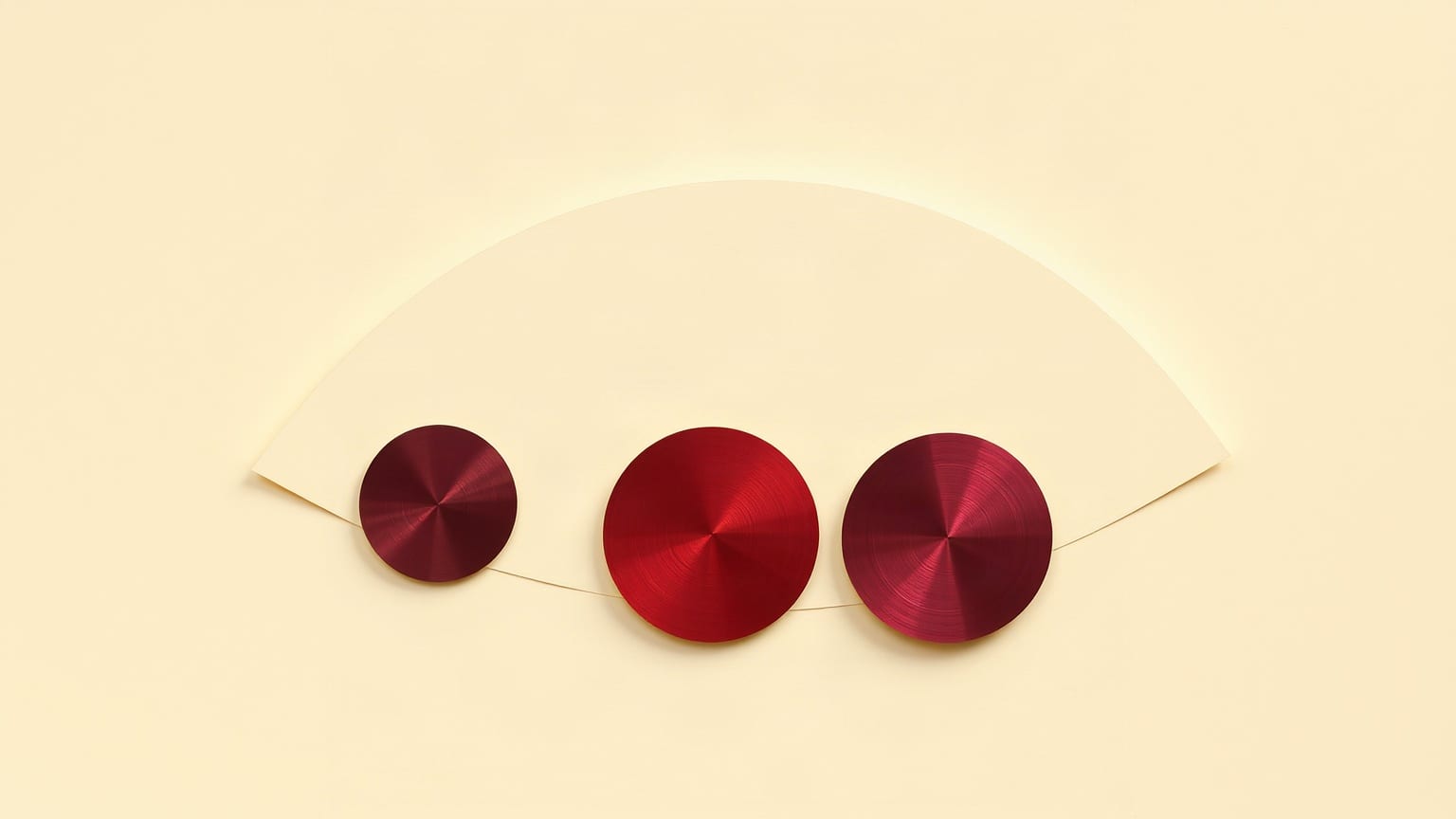Cut-paper illustration: three discs spaced along the curve of a folded globe.