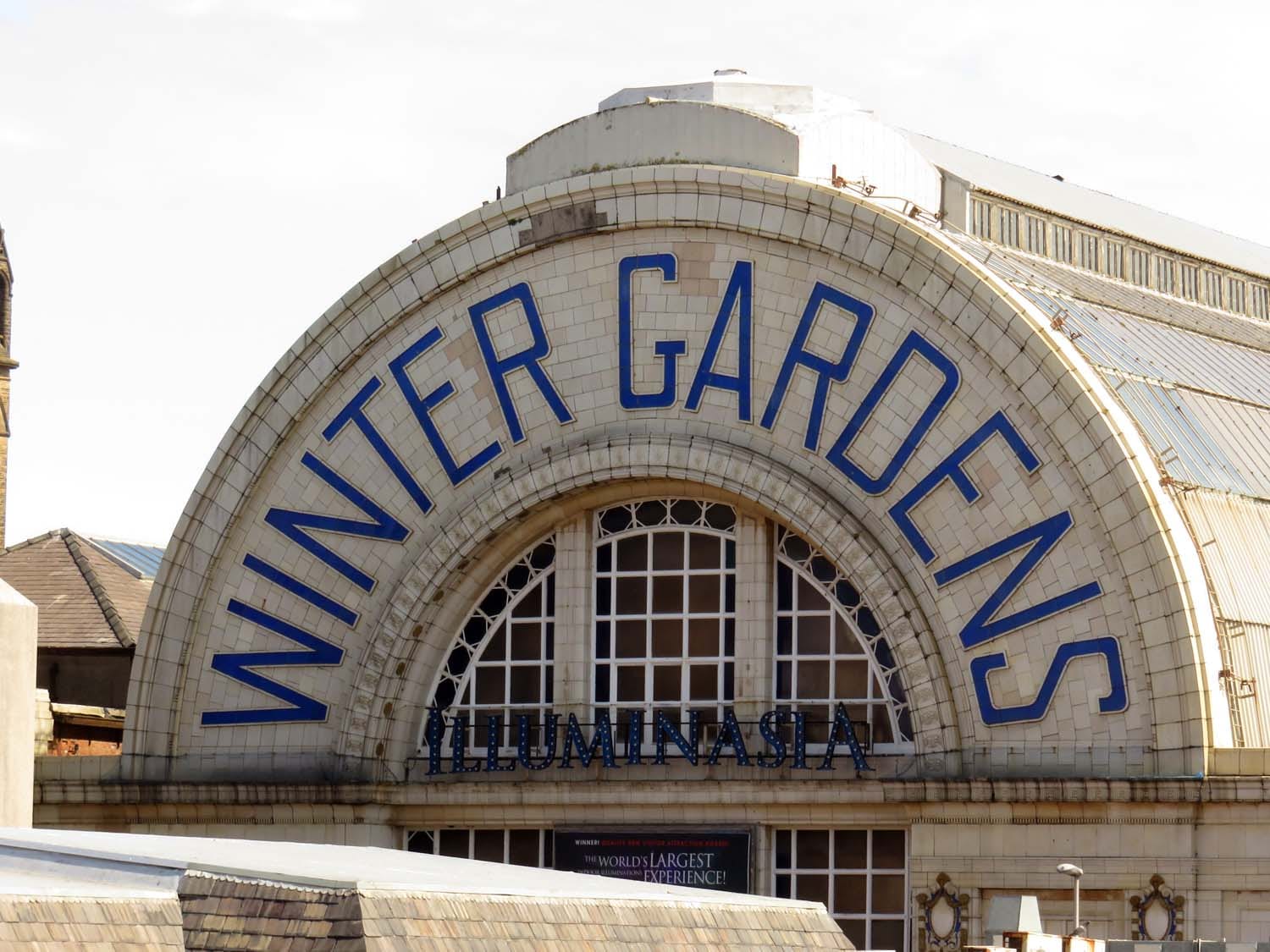 The tiled arch lettered Winter Gardens on Church Street, Blackpool; the Opera House stands inside the same complex.