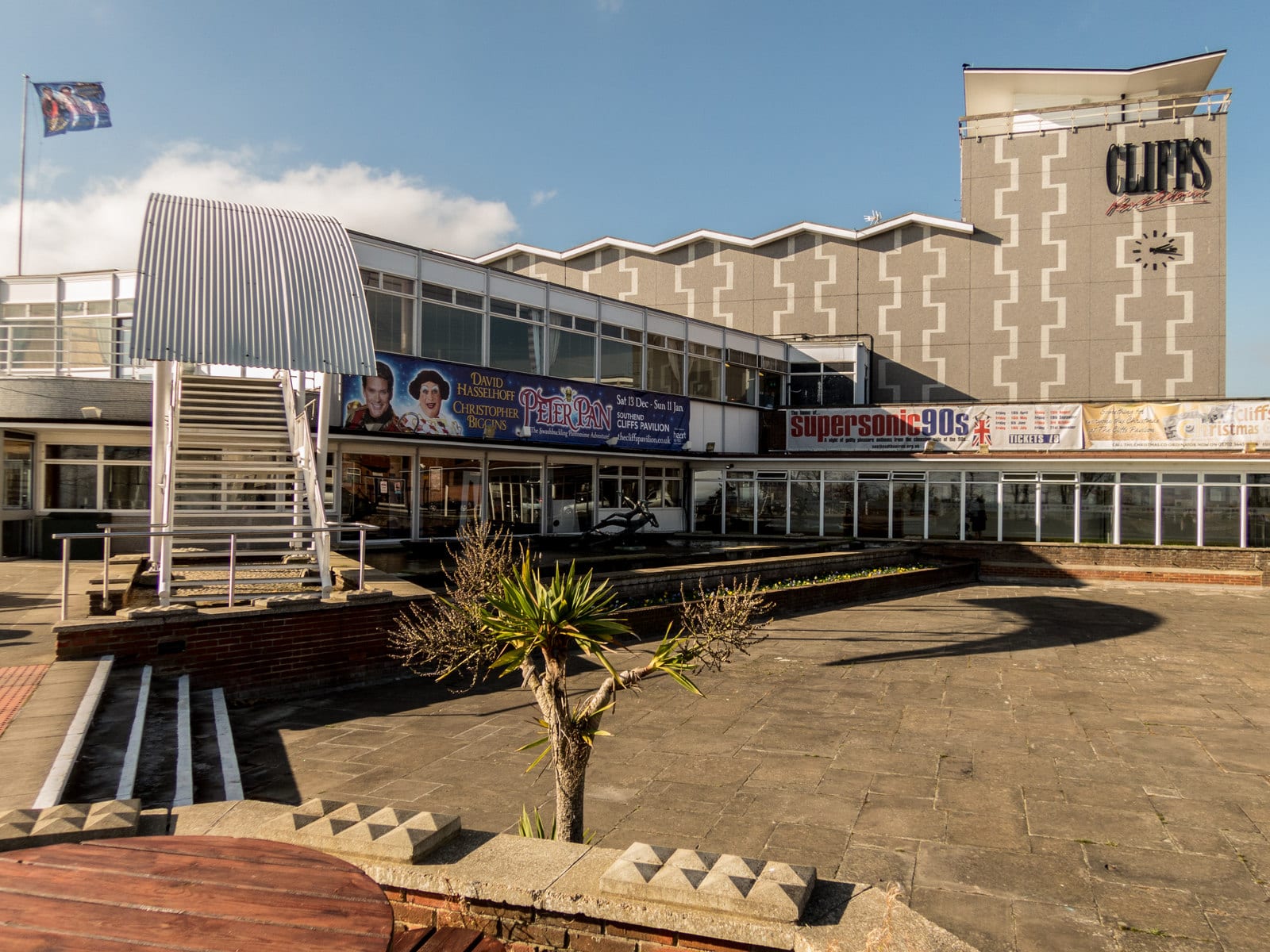The Cliffs Pavilion above its terrace at Westcliff-on-Sea, its name across the clock tower.