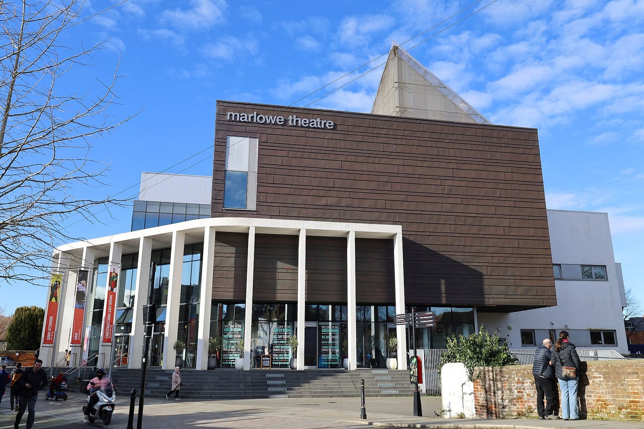 The Marlowe Theatre in Canterbury, its brick fly tower standing over a colonnaded glass foyer.